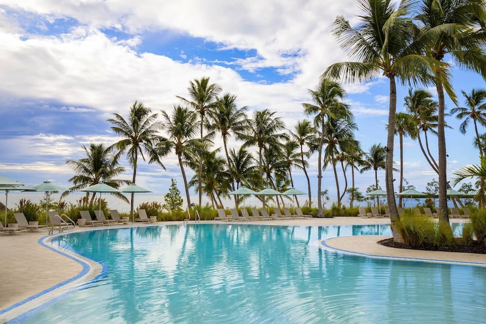 Amara Cay Resort oceanfront pool deck at sunset in Islamorada, Florida Keys