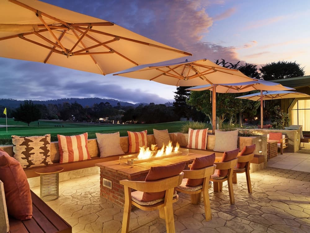 Hyatt Regency Monterey Hotel & Spa outdoor fire pit and golf course patio at sunset